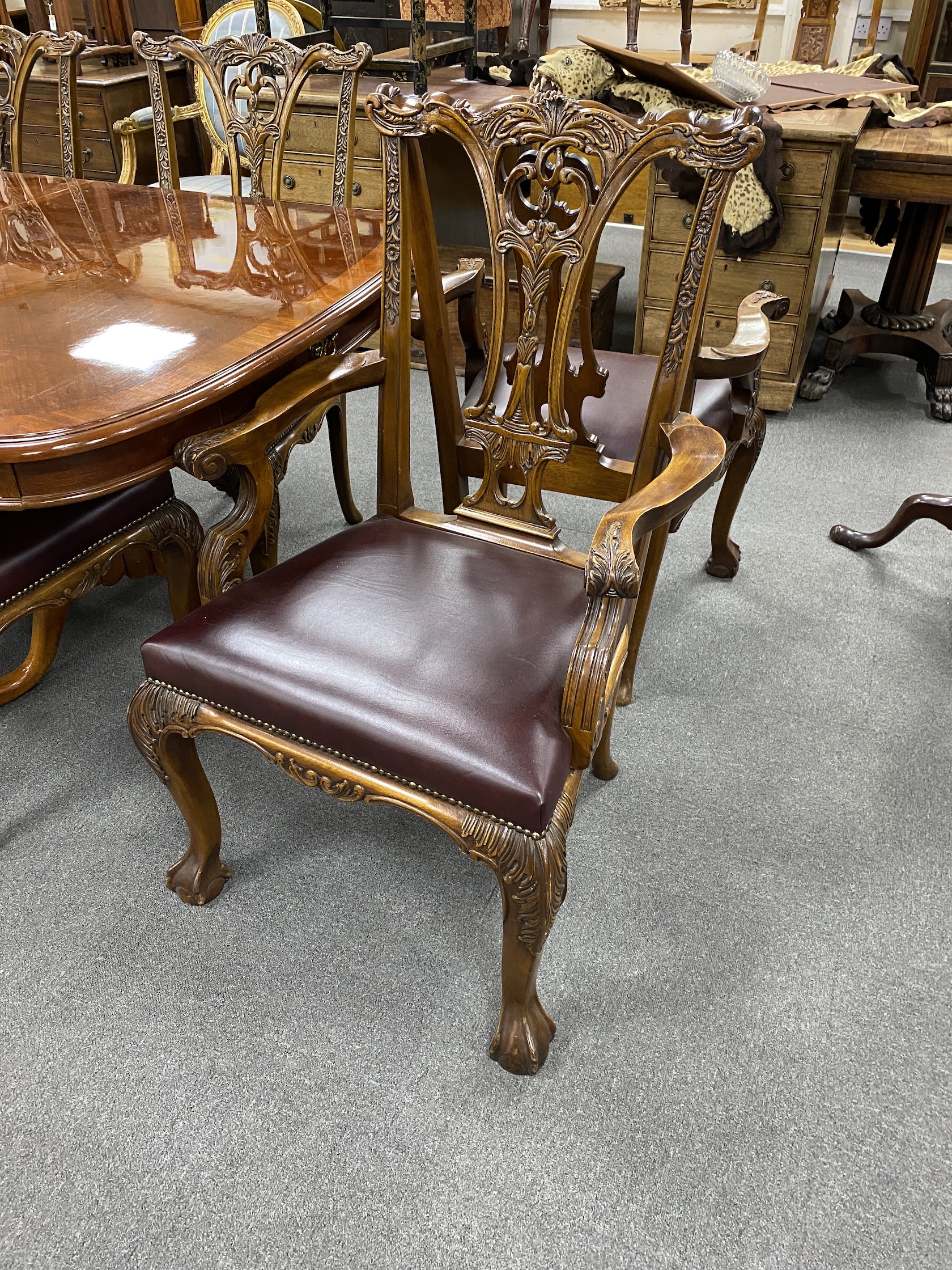 A reproduction inlaid mahogany twin pillar extending dining table, approx. 250cm extended, two spare leaves, width 110cm, height 75cm, together with eight Chippendale style mahogany dining chairs, two with arms